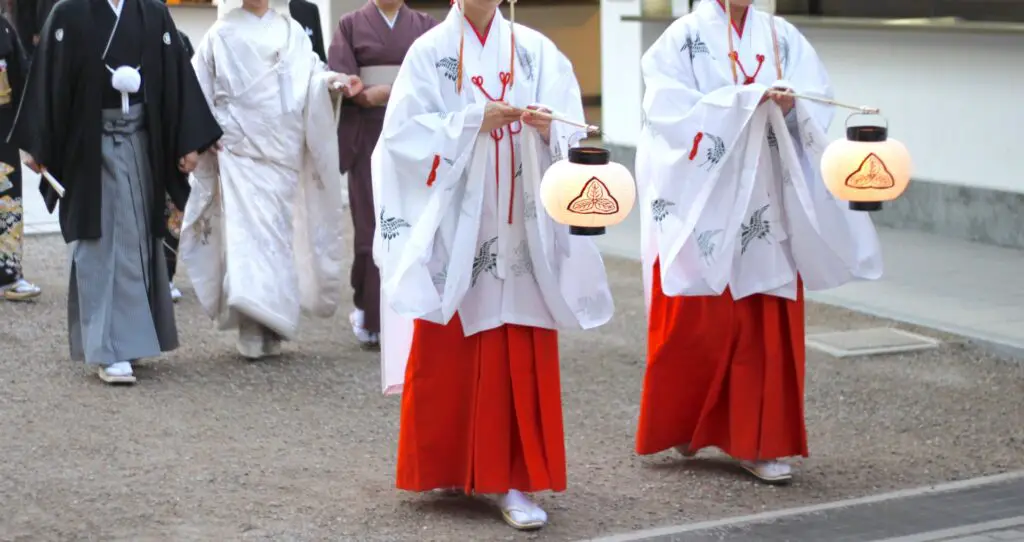 Two priestesses in a traditional Japanese wedding